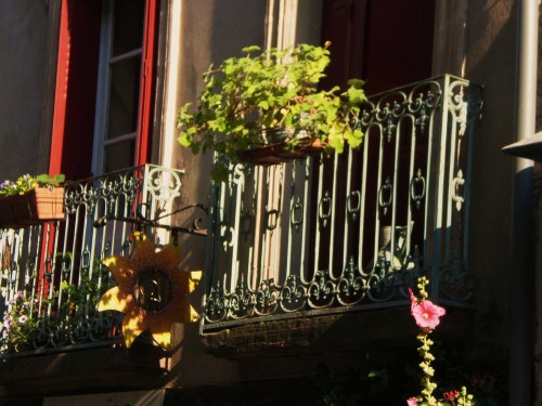 Cordes shutters and metal railing on balcony FAV